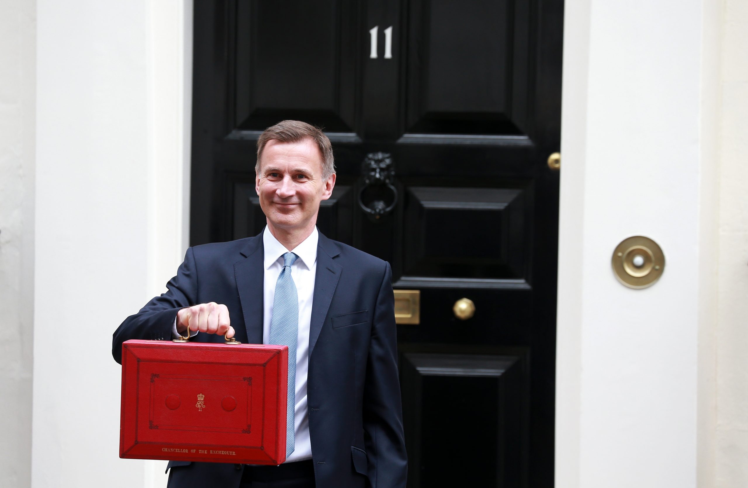 Jeremy Hunt holding the red briefcase for the budget.